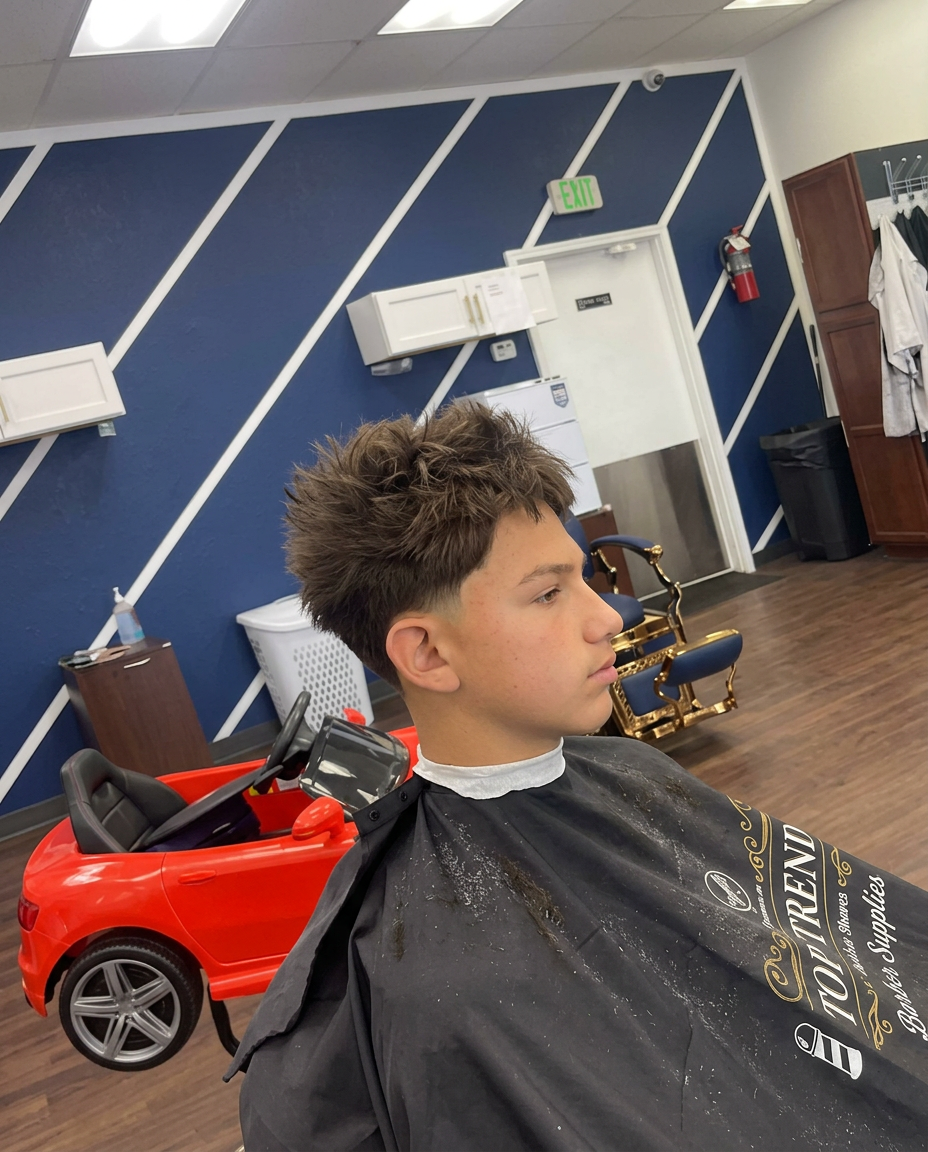 Textured haircut with tapered sides at Top Trend